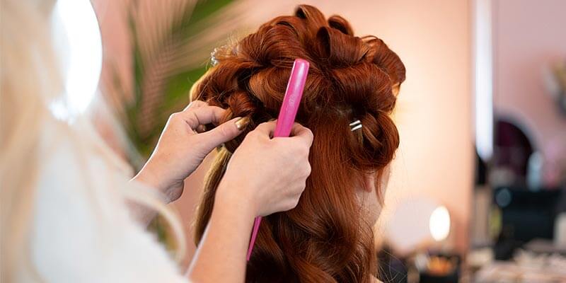 Woman having hair styled